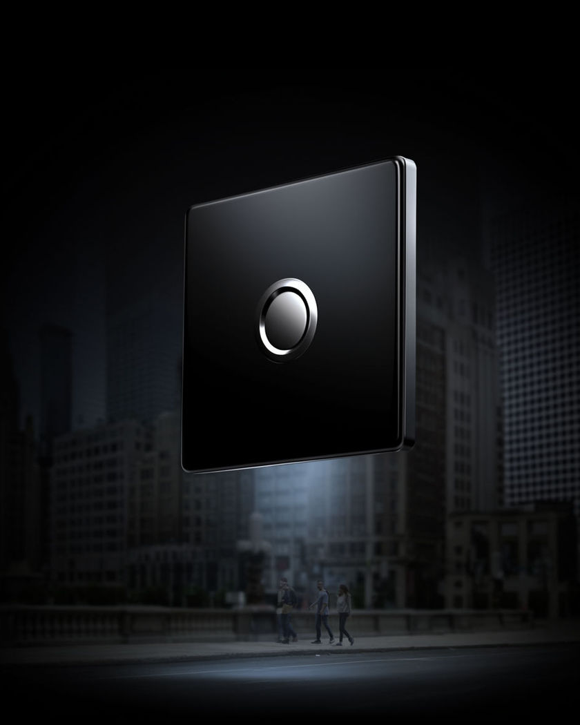 A product held weightless above a city street, the skyline soft behind it and light pooling under the drift