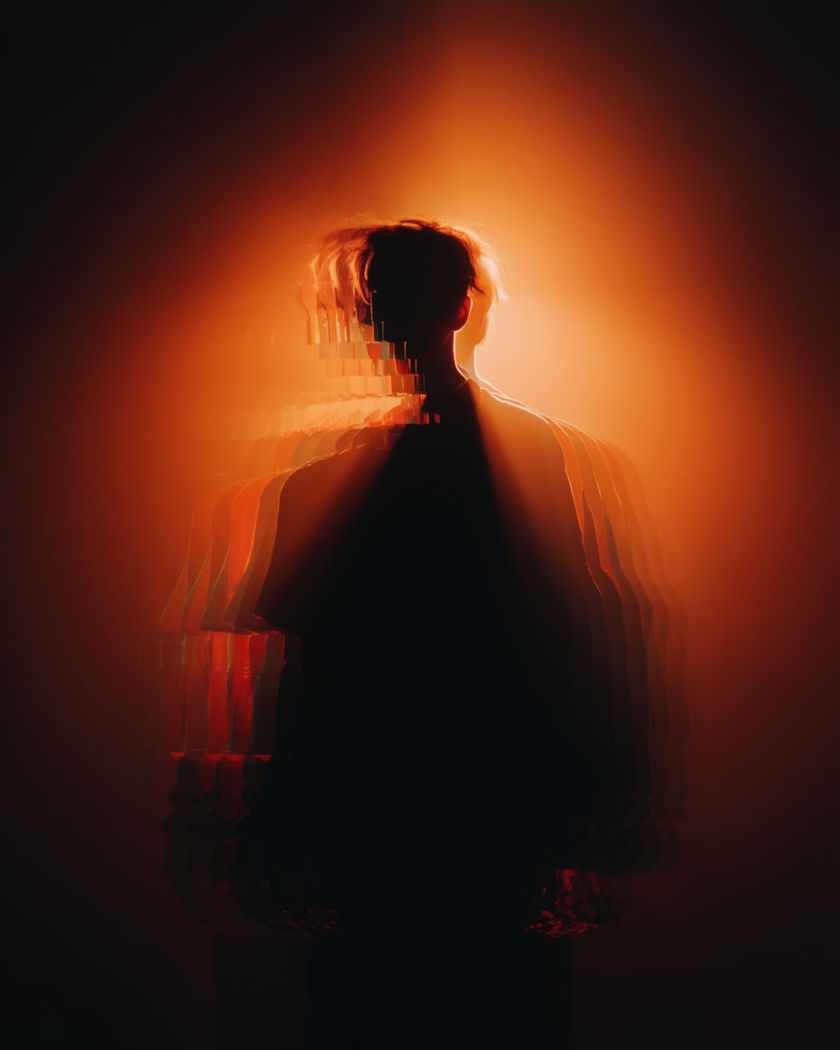 A figure splitting into flickering, glitching duplicates that shift and never fully settle