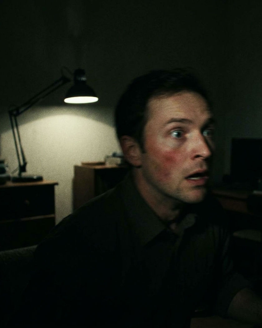 A head snapping to the side at the moment of a slap, a stunned face in a dim room