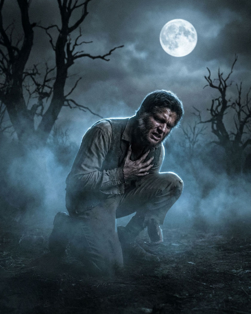 A person mid-change into a wolf-like creature under a full moon, fur spreading across the skin