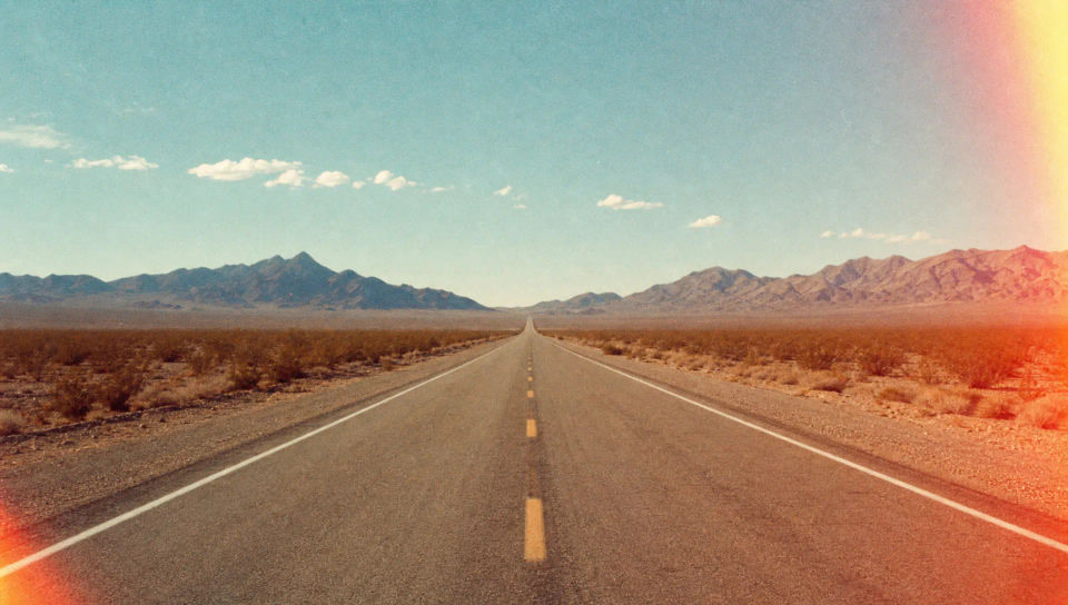 Desert highway with light leak