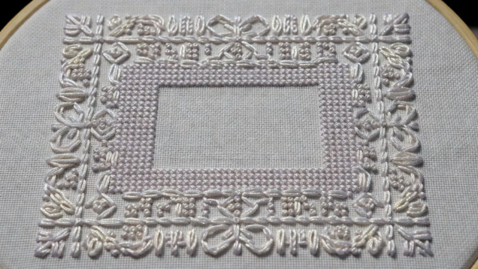 Cross-stitch sampler panel